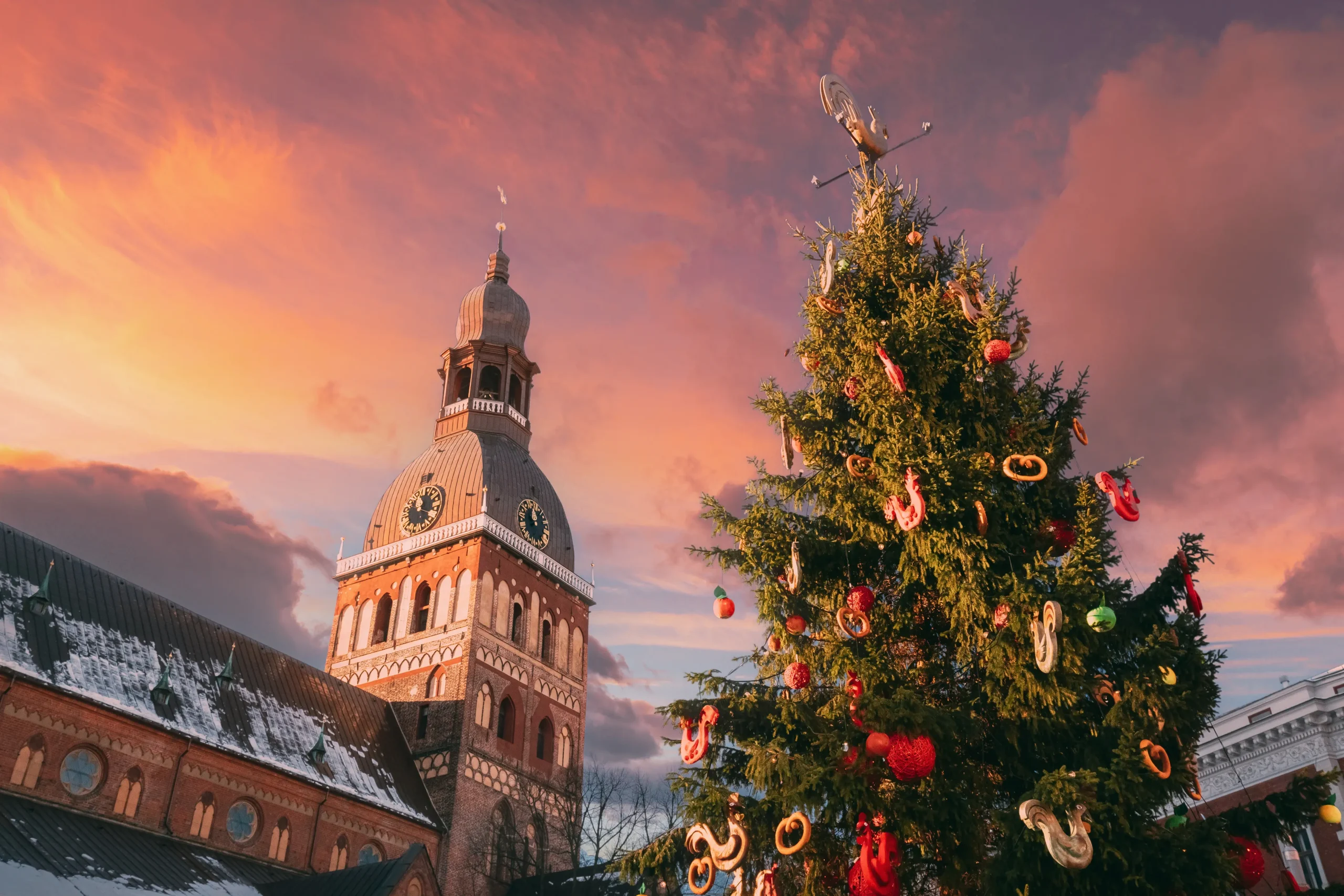 Riga Christmas Market stalls and lit tree on Dome Square in Riga Old Town